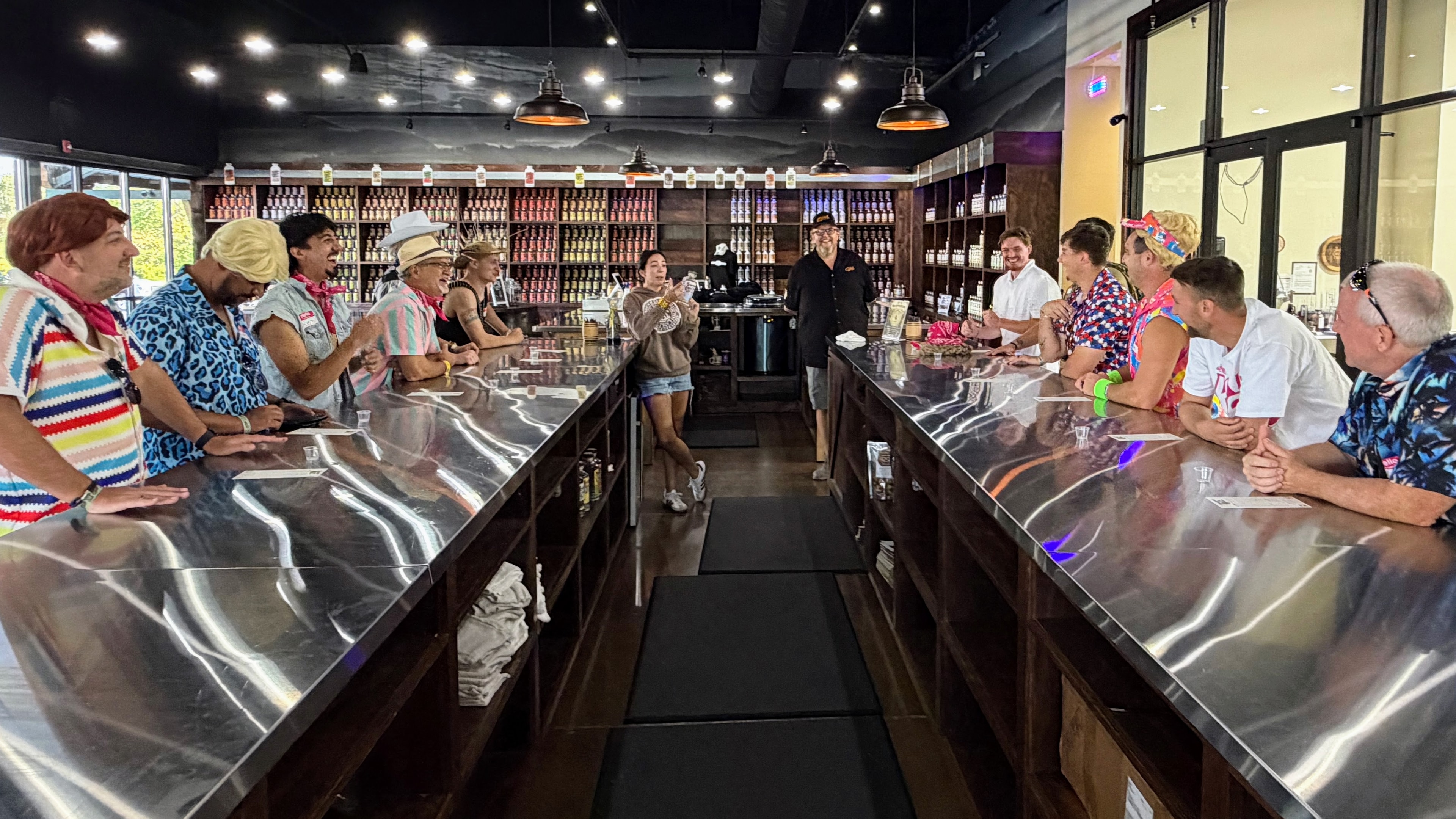 Guests tasting spirits at a distillery stop